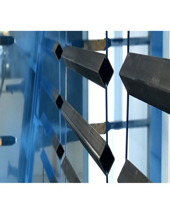 Electrostatic powder coating spray gun applying coating to metal parts